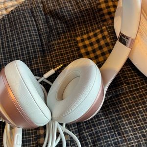 Beats rose gold and white headphones